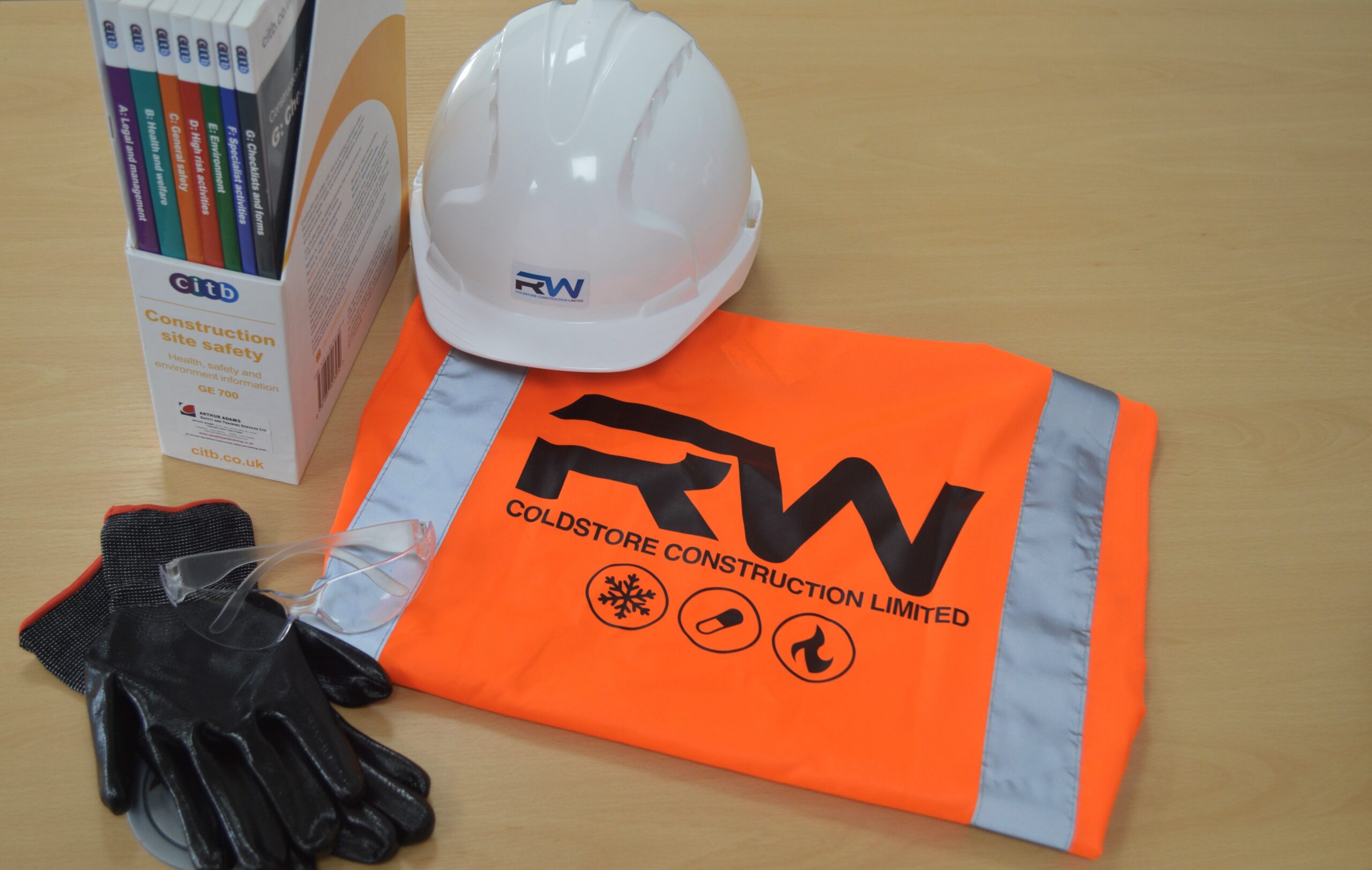 RW Coldstore Construction branded PPE including hard hat, hi-vis vest, gloves and CITB safety documentation